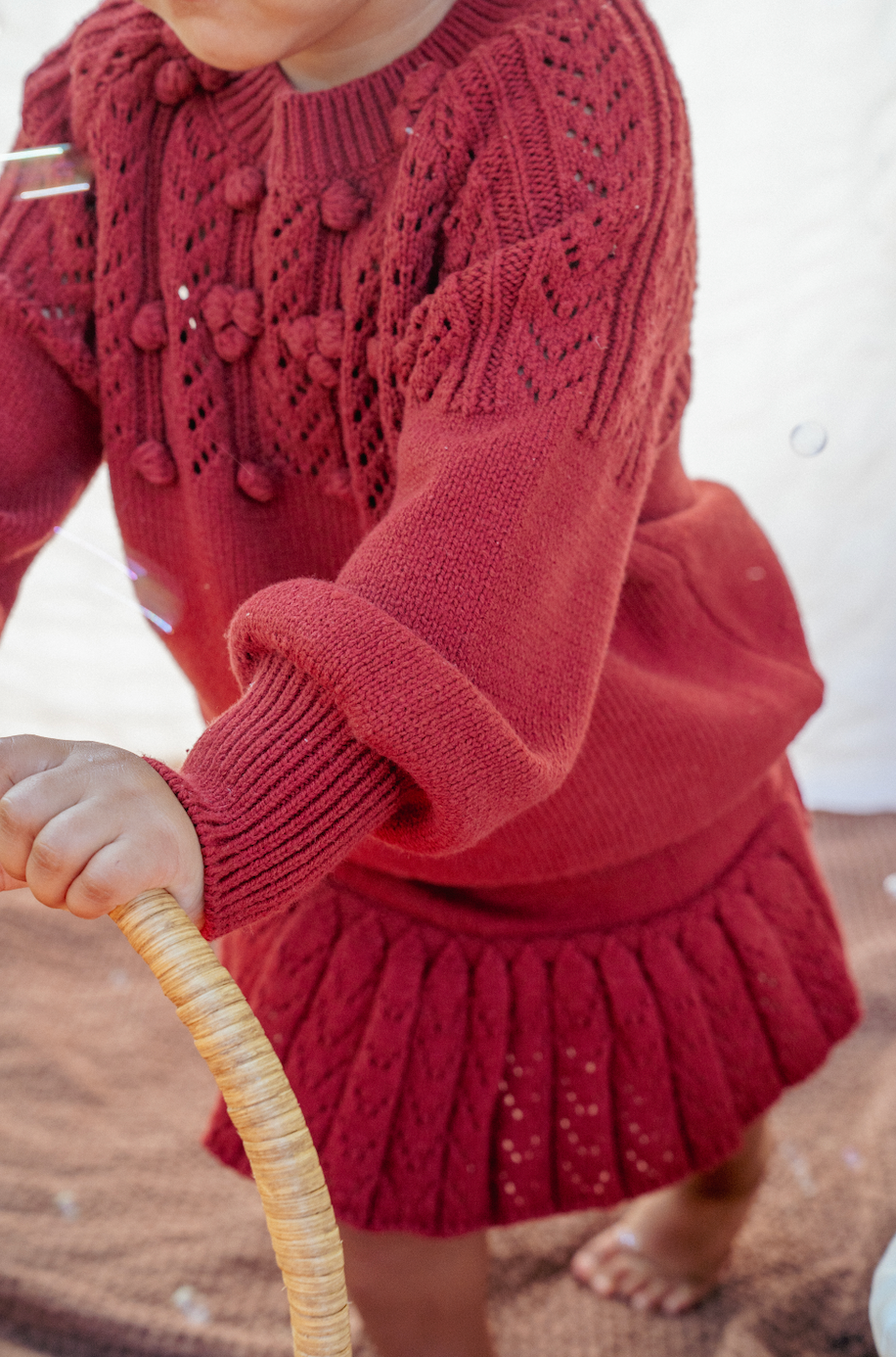 The red pom-pom knit skort