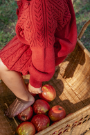 The red pom-pom knit sweater