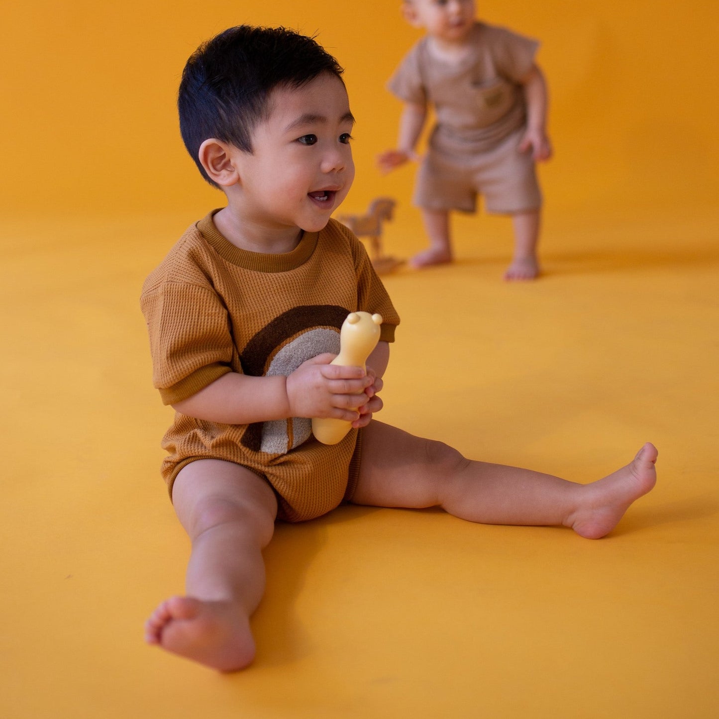 The bold rainbow romper Caramel